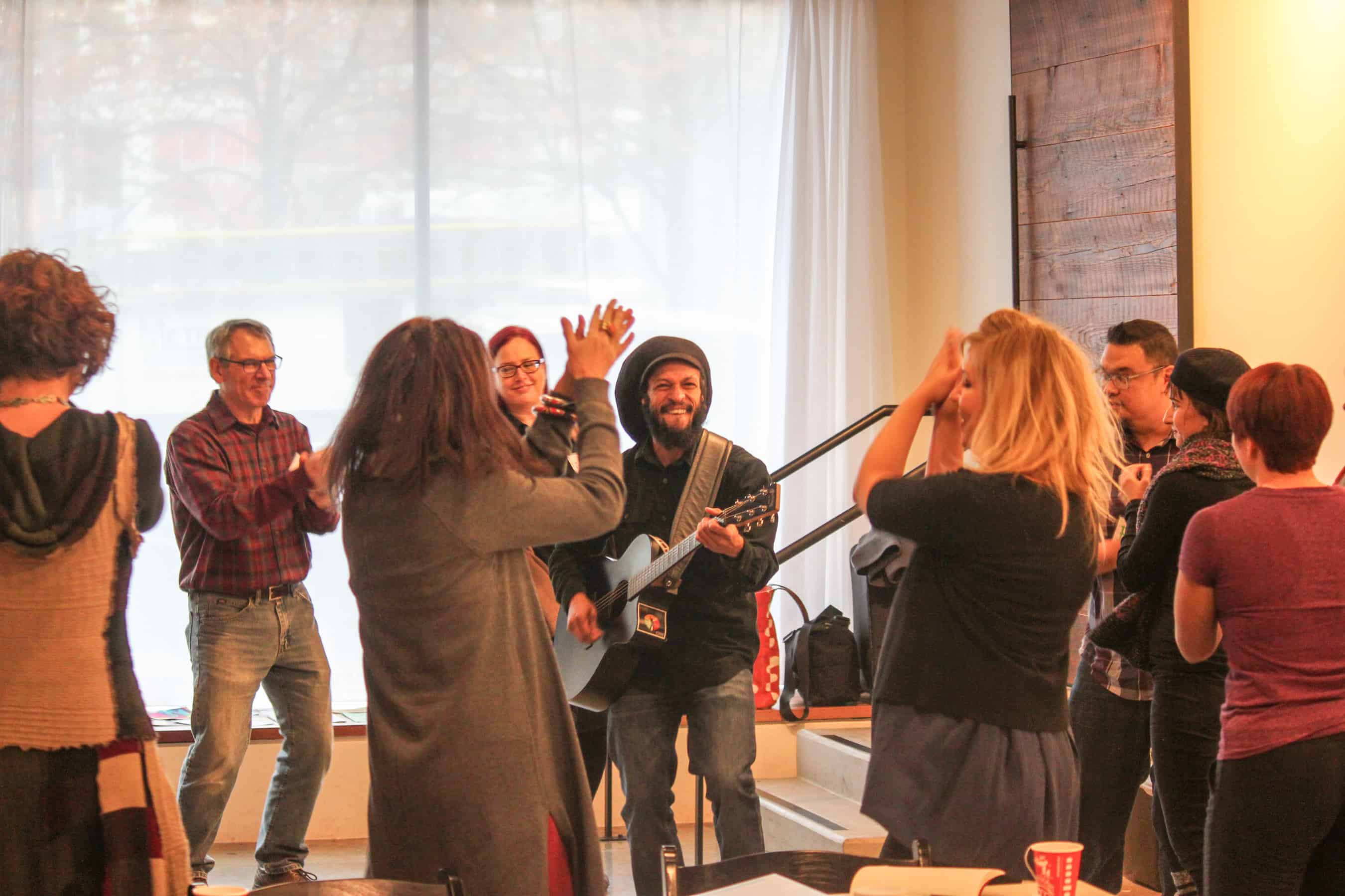 AaronNigelSmith-TAS1617 Teaching Artist Aaron Nigel Smith leads cohort members in song making activity