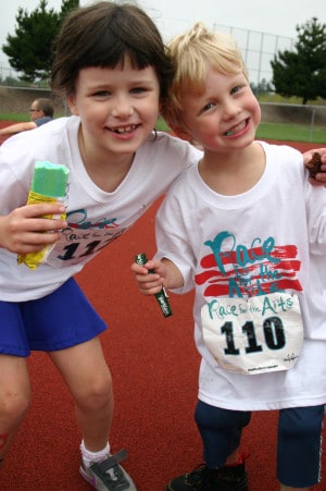 A couple of young runners cool off after the 2013 Kids Dash.